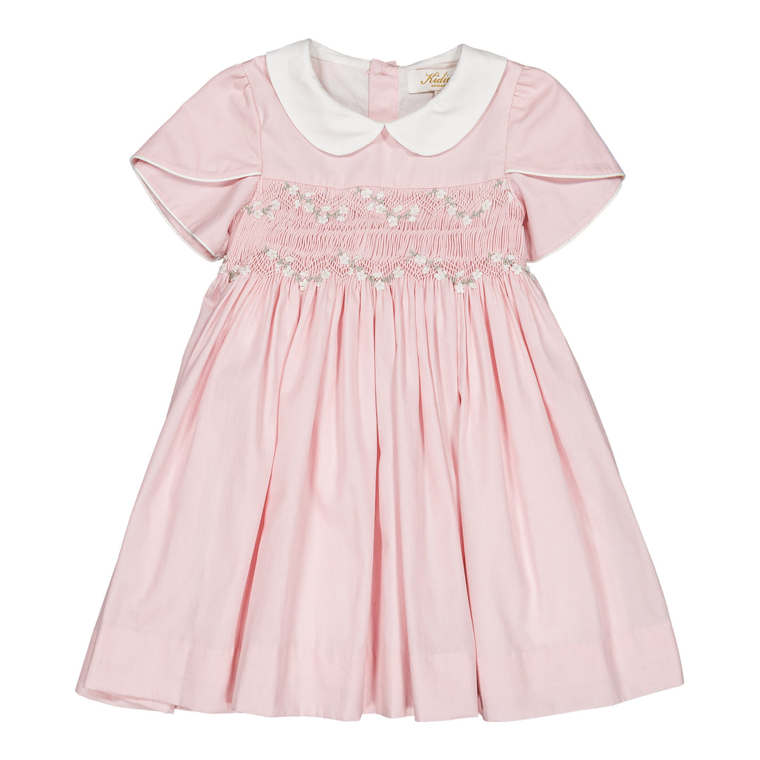Pink dress with white collar on a white background