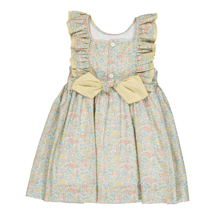 Floral dress with ruffled sleeves and a bow on a white background