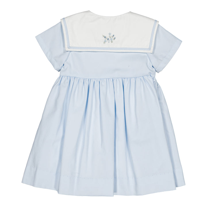 Light blue dress with white trim on a white background