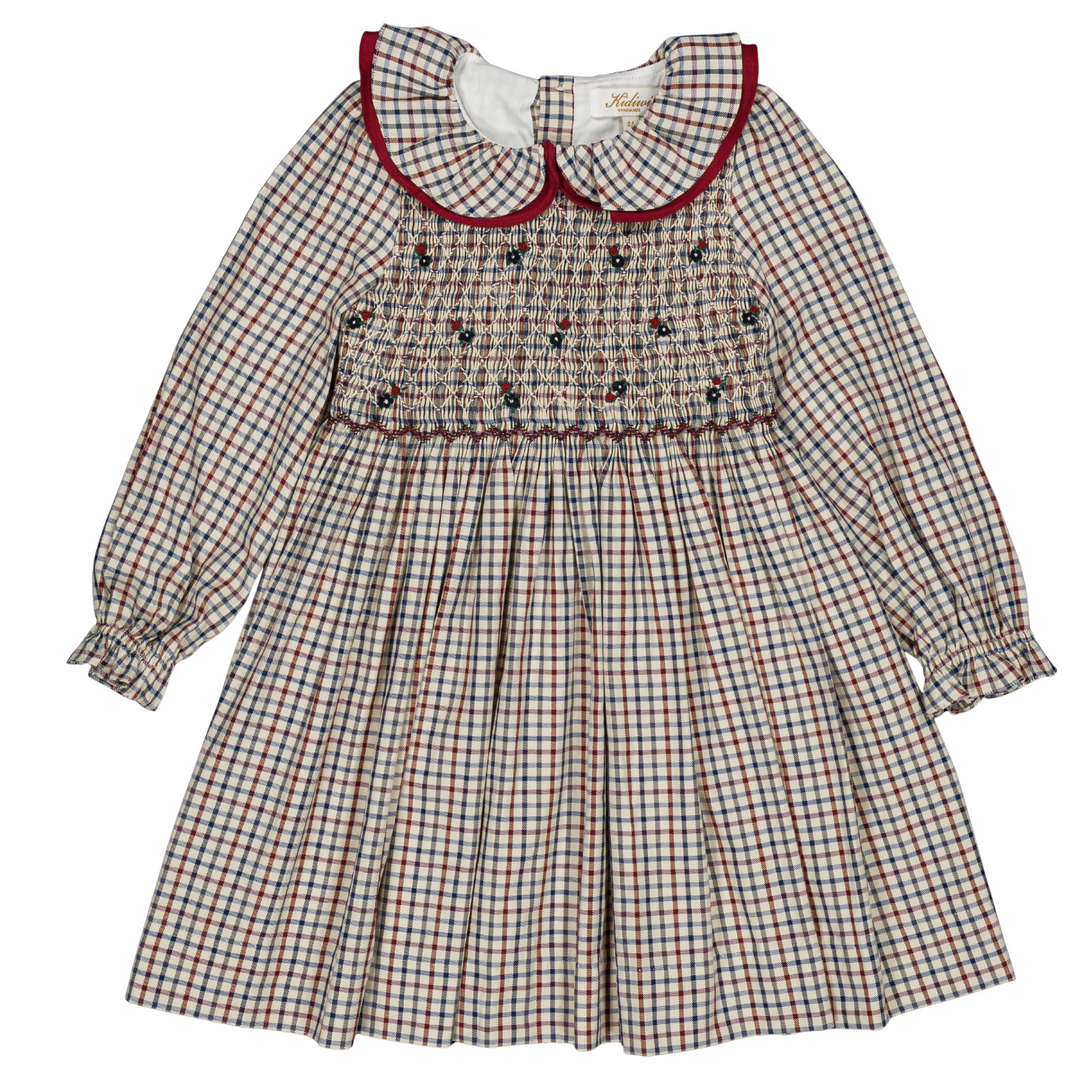 Front view of a girls holiday plaid smocked dress
