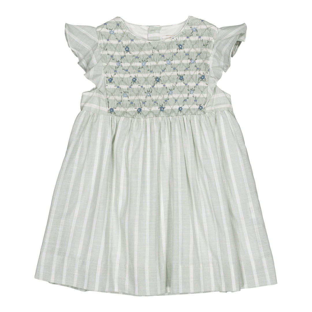 White dress with floral smocking on a white background
