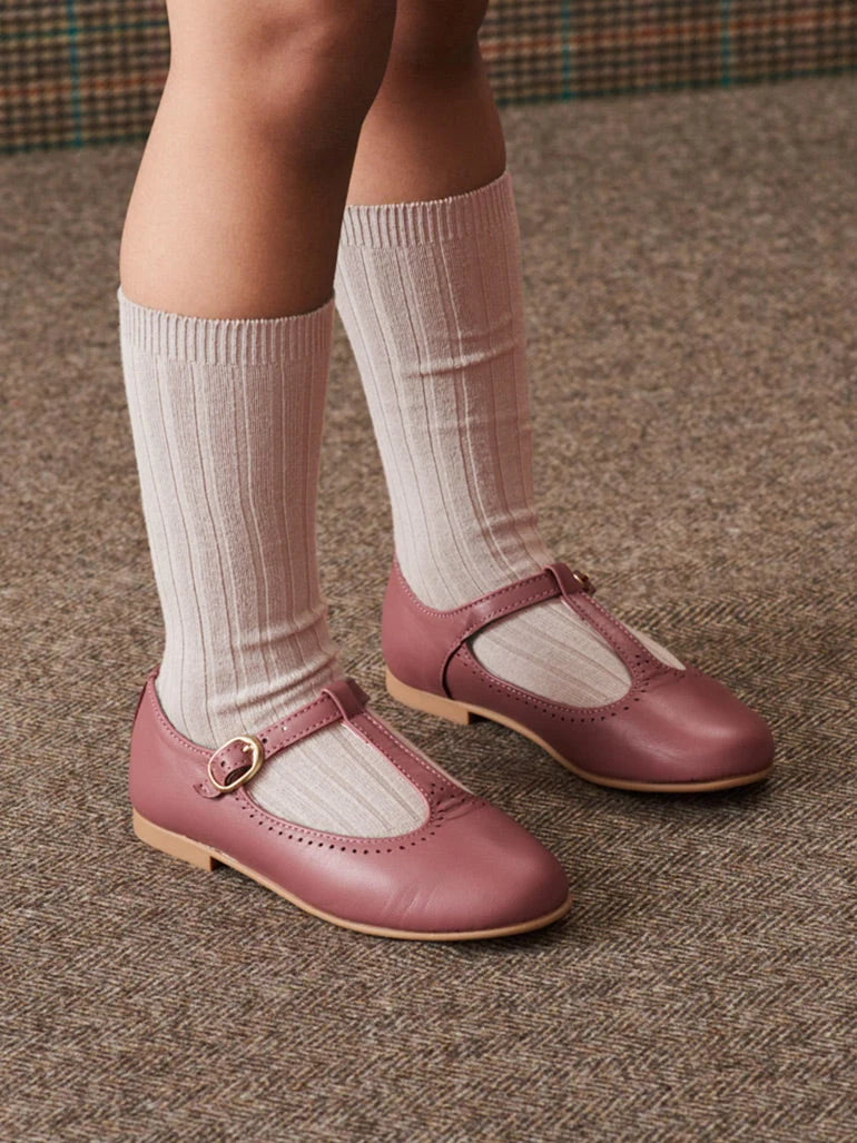 girl wearing knee high pale pink socks