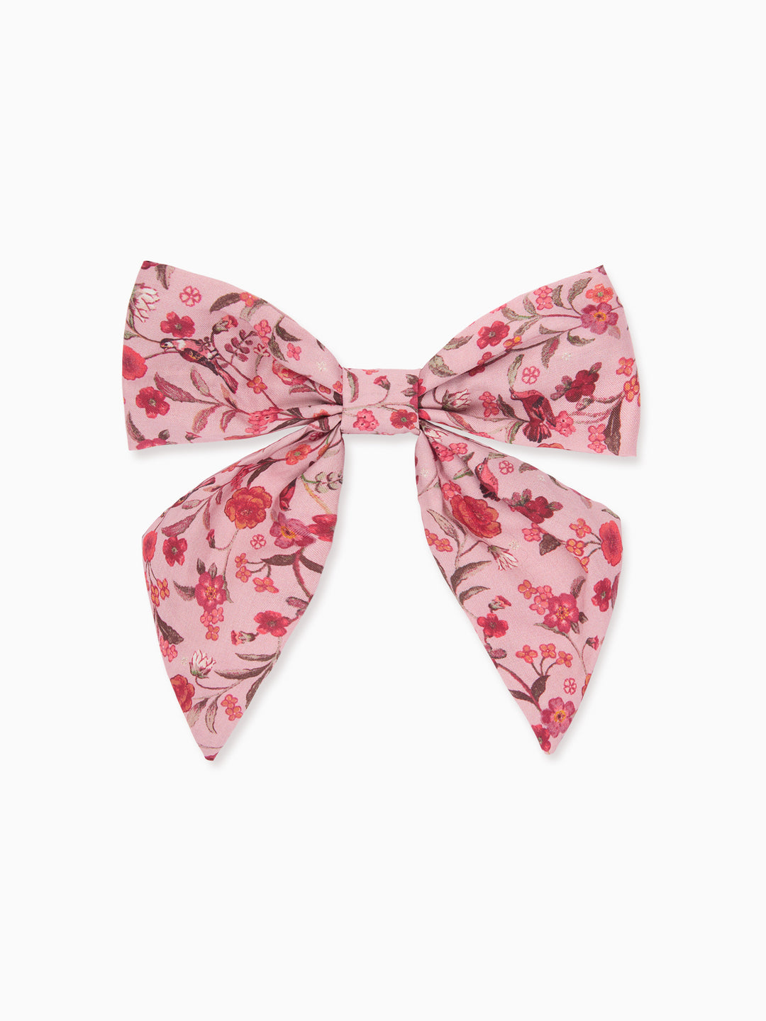 A pink bow accessory with a red and green floral pattern, displayed flat against a light gray background.
