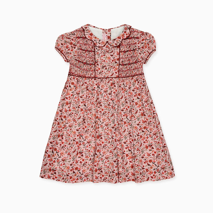 A toddler girl's short-sleeve dress with a red and white floral print, featuring a Peter Pan collar, decorative chest detailing, and a gathered skirt, shown against a plain white background.
