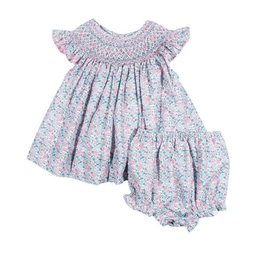 Floral baby dress with ruffled sleeves and bottom on a white background