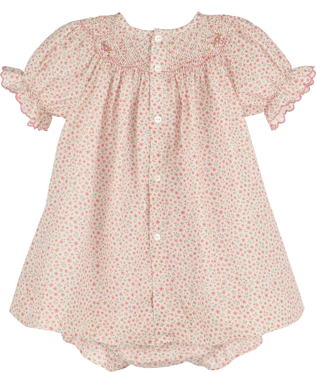 A baby girl's smocked dress with short flutter sleeves, featuring a delicate pink and green floral print on a cream background, with white buttons down the front.
