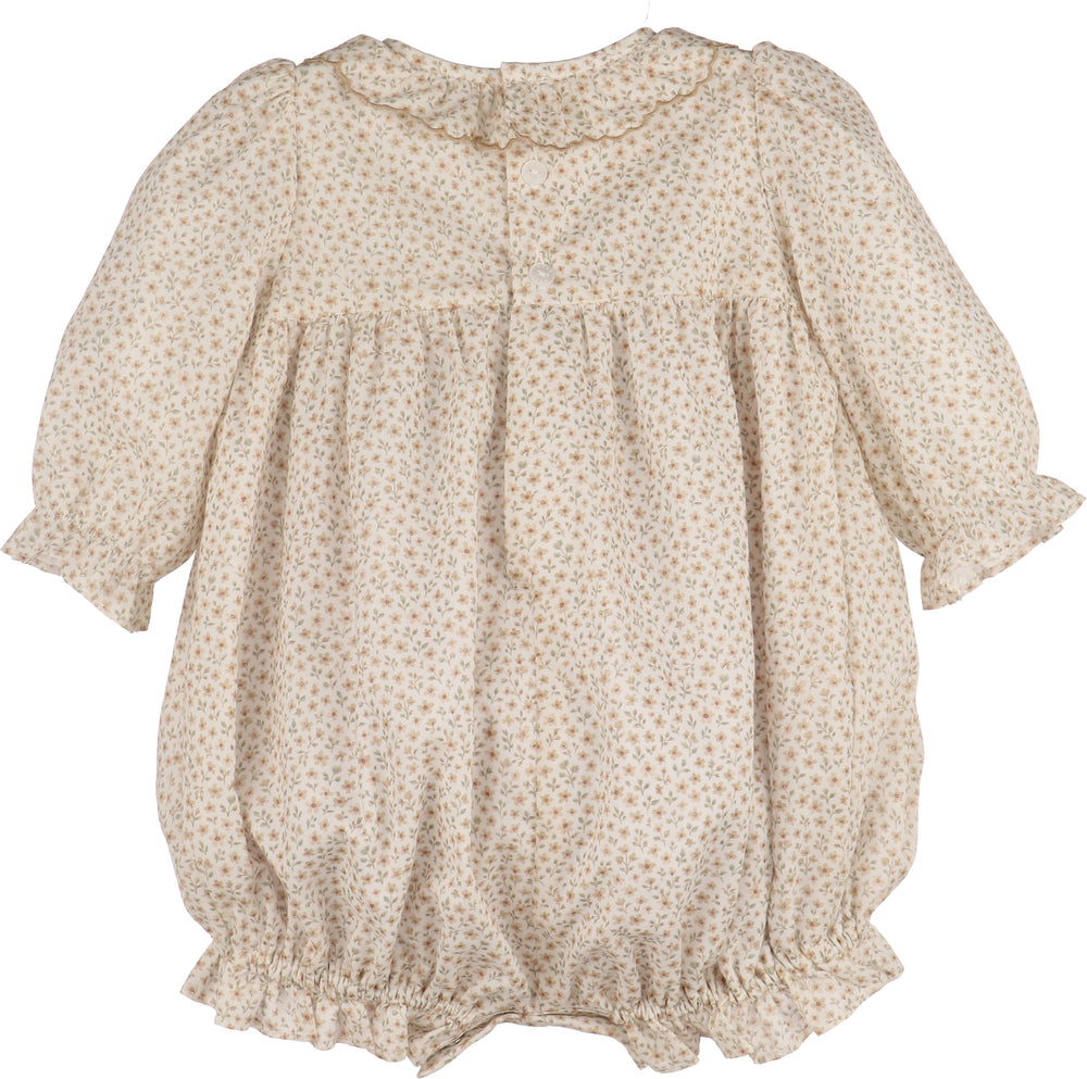 Beige floral-patterned baby romper on a white background