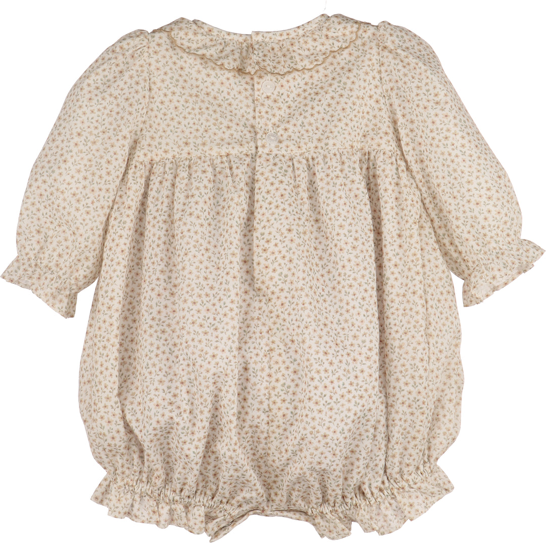 Beige floral-patterned baby romper on a white background