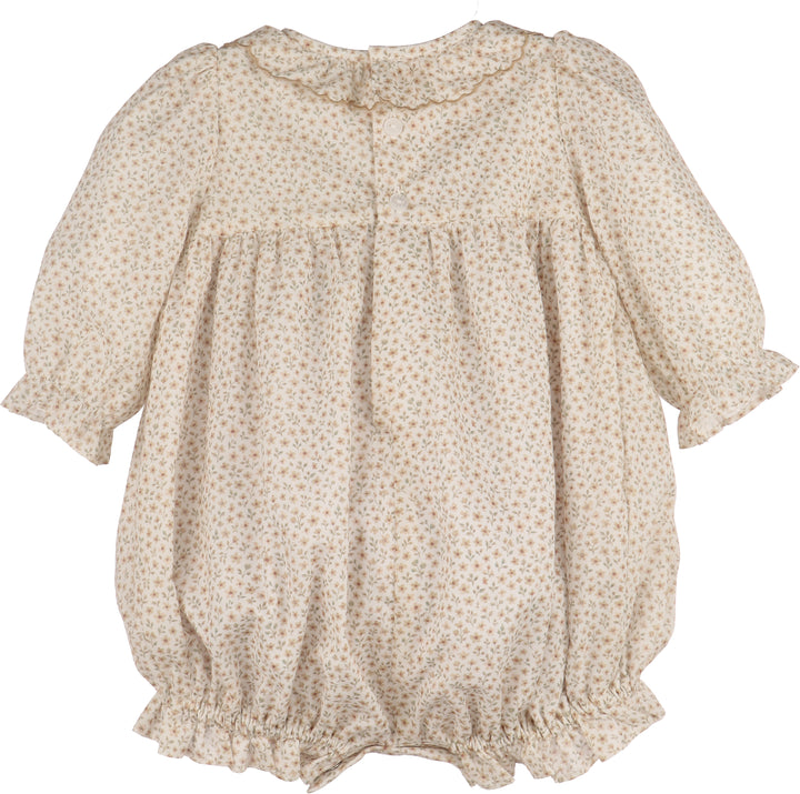Beige floral-patterned baby romper on a white background