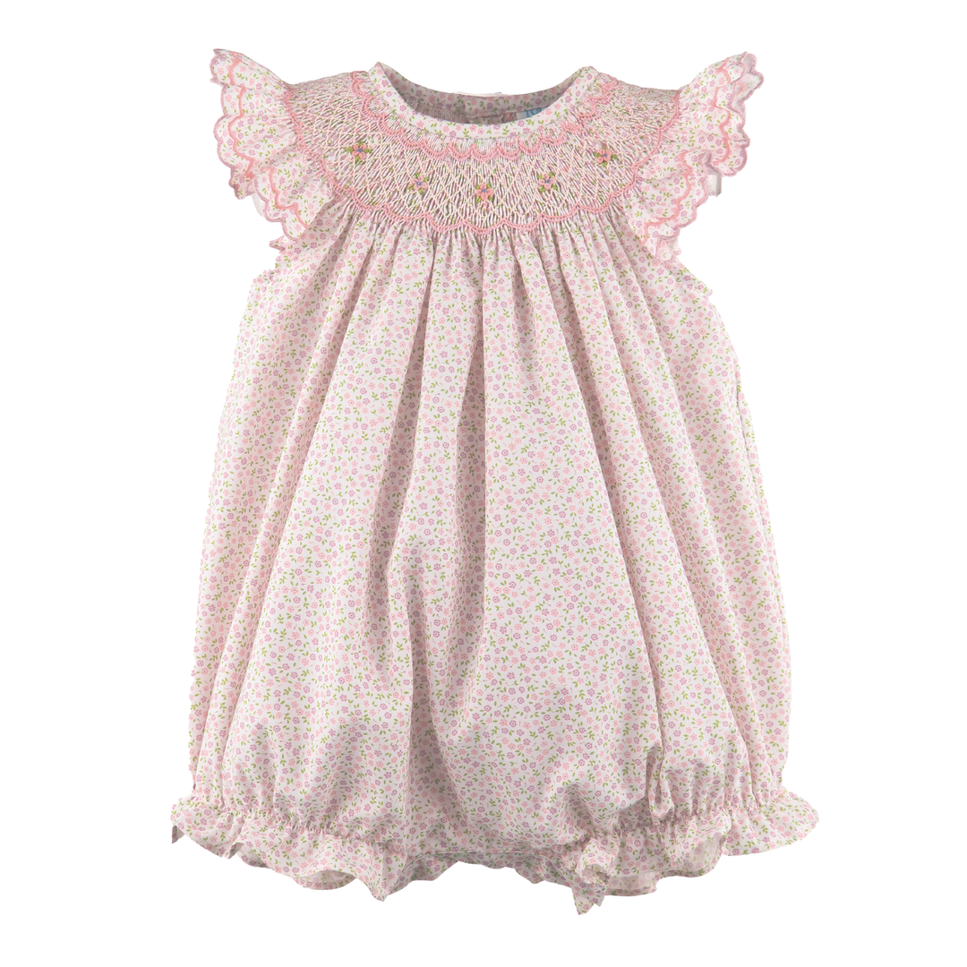baby romper with pink floral print and smocking detail