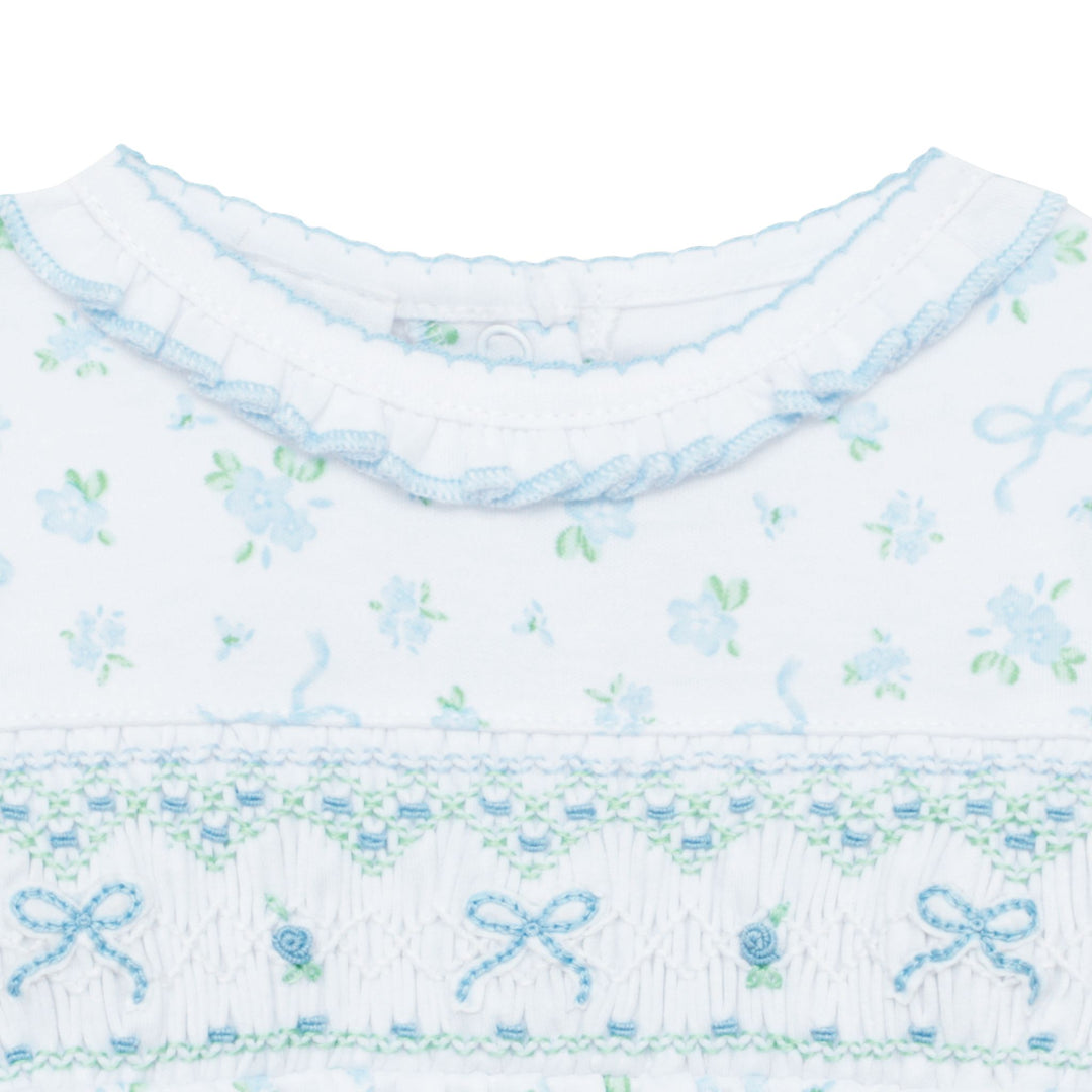 Textile with floral and bow pattern on a white background