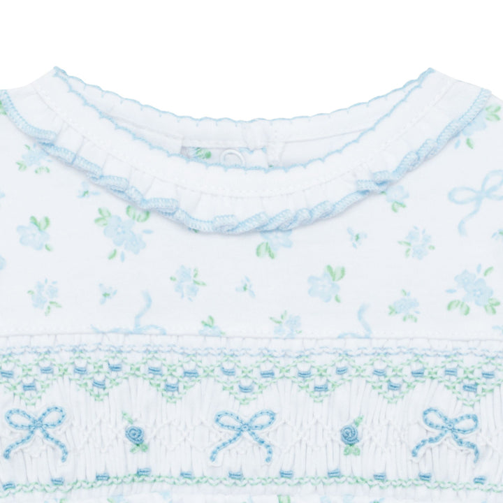 Textile with floral and bow pattern on a white background