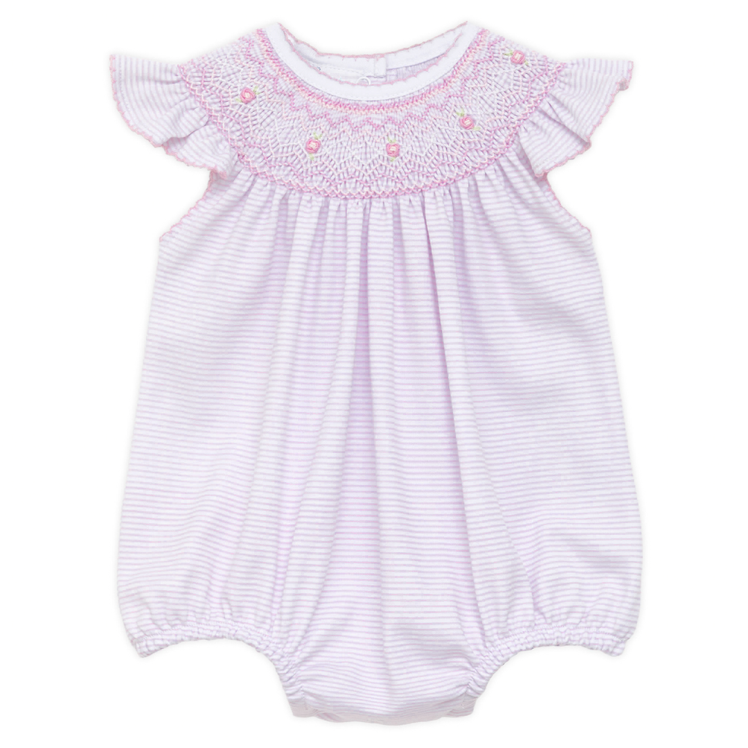 Baby romper with smocked neckline on a white background