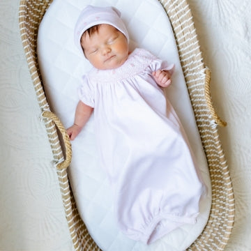 baby sleeping in smocked bown