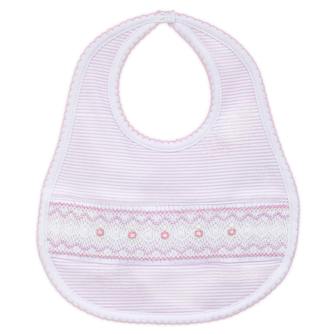 White baby bib with pink trim on a white background