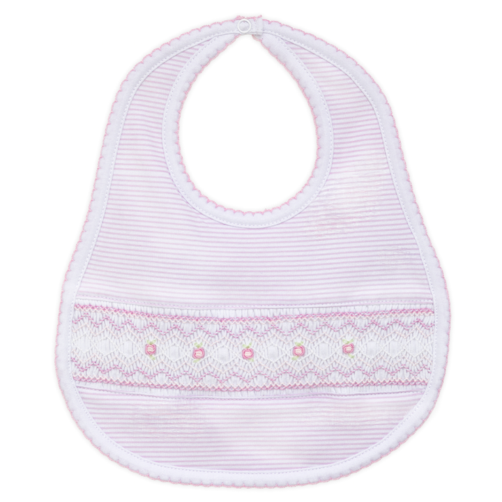 White baby bib with pink trim on a white background