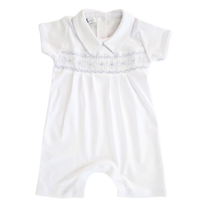 White baby romper with decorative trim on a white background