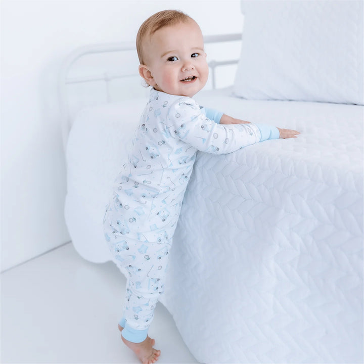 Baby wearing pajama set with golf pattern