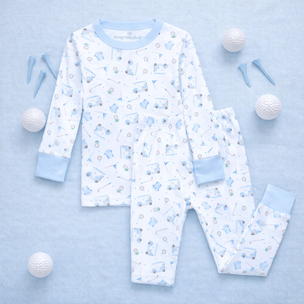 Children's pajama set with golf pattern on a light blue background