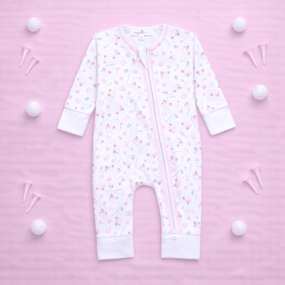 White baby onesie with pink floral pattern on a pink background