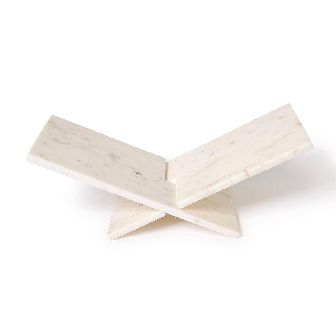 a marble book stand displaying a coffee table book
