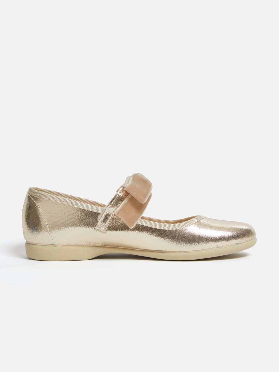 A single metallic gold flat shoe with a matching fabric bow on the strap, shown in profile against a plain white background.