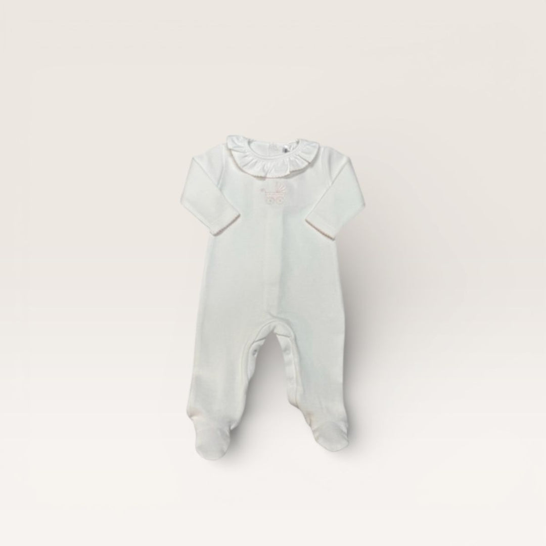 A baby footed sleeper in a very pale mint green, featuring short sleeves, a ruffled collar, and integrated feet, laid flat on a light beige background.