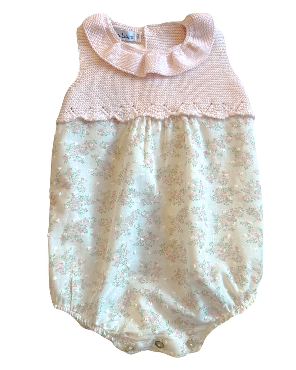 Baby romper with floral pattern and ruffled collar on a white background