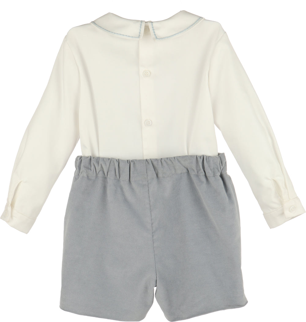 White shirt with long sleeves and blue shorts on a white background