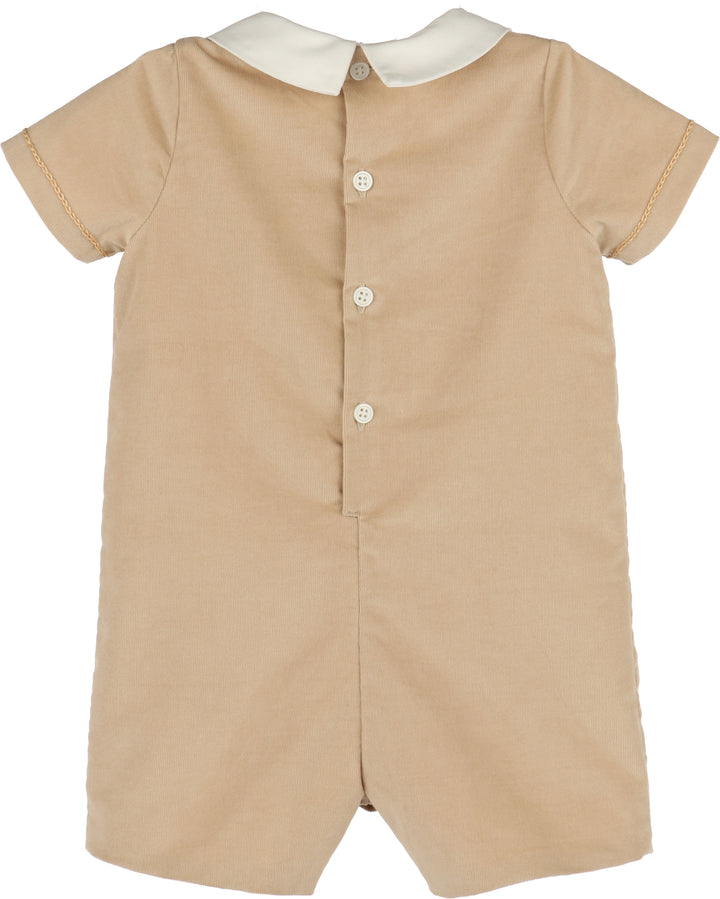 Beige baby romper with white collar on a white background