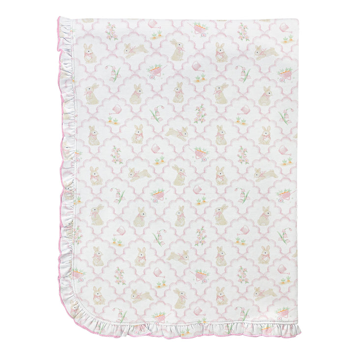 Baby blanket with bunny and tulip pattern on a white background