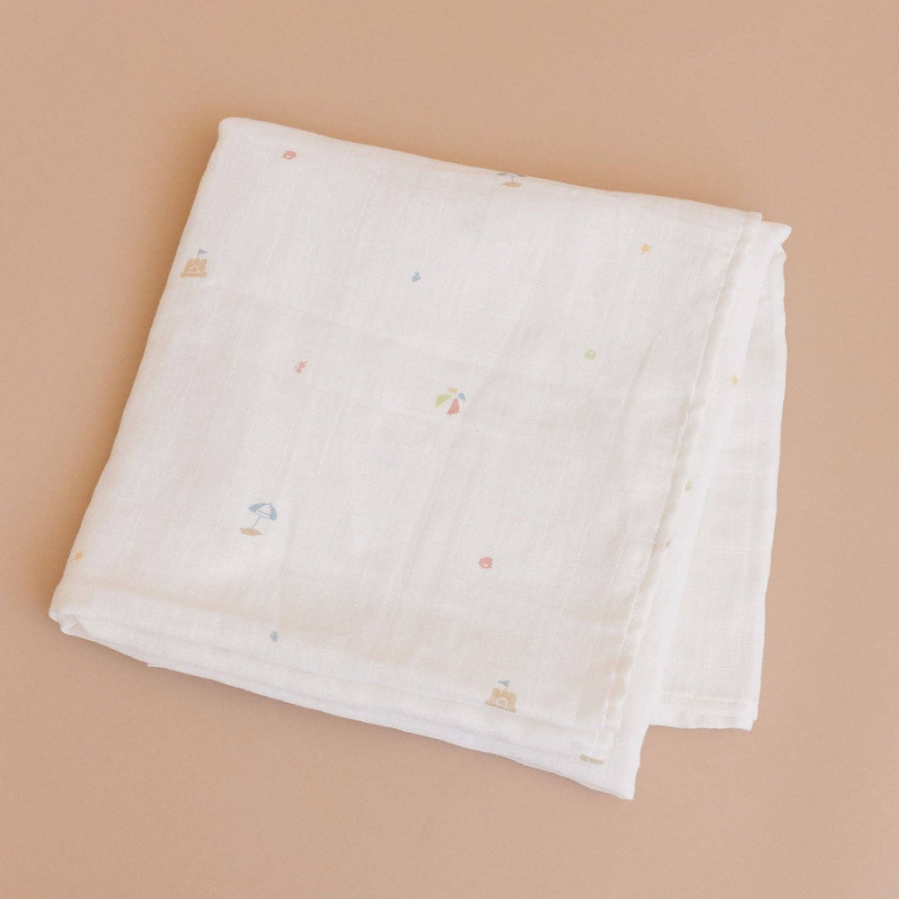 folded beach theme swaddle blanket