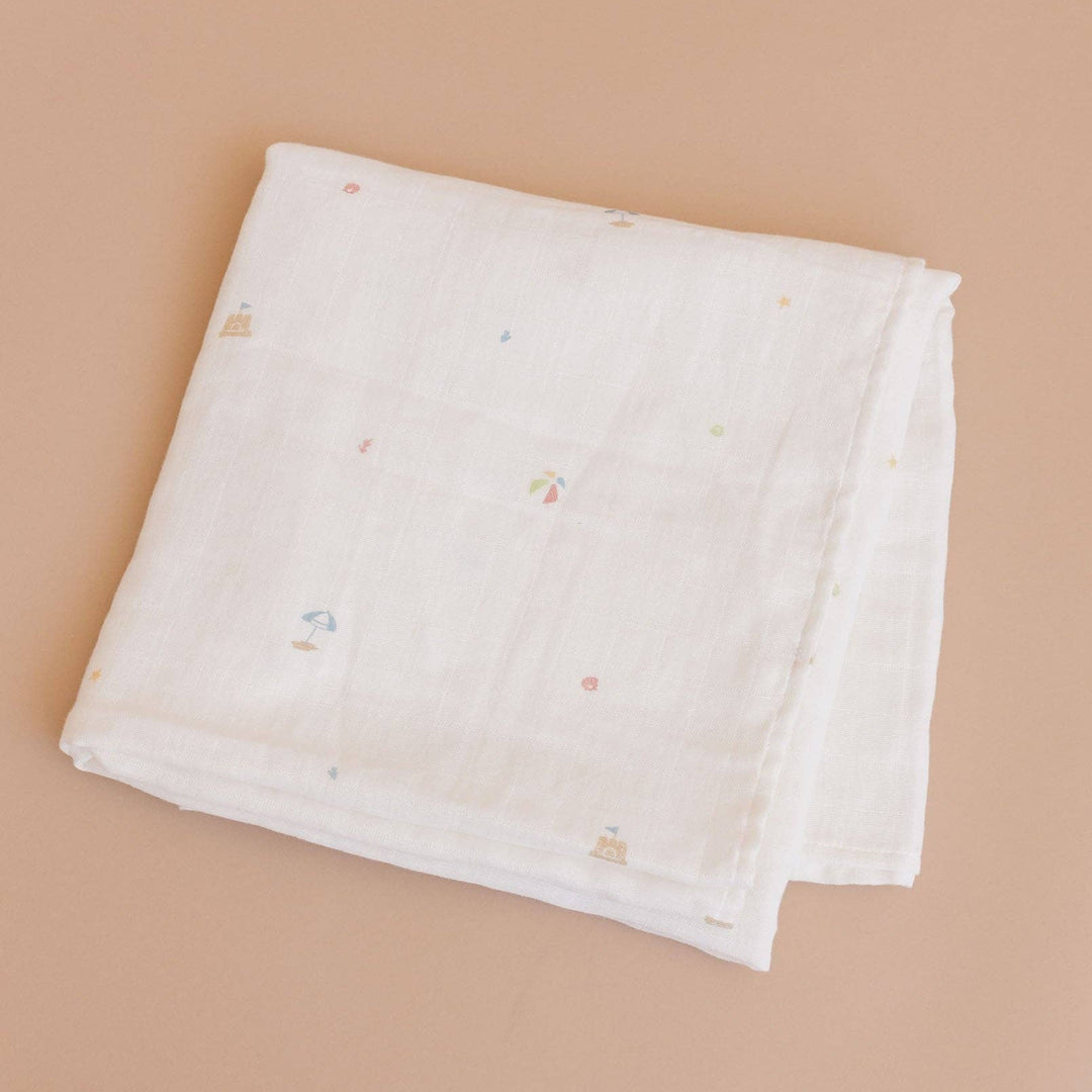 folded beach theme swaddle blanket