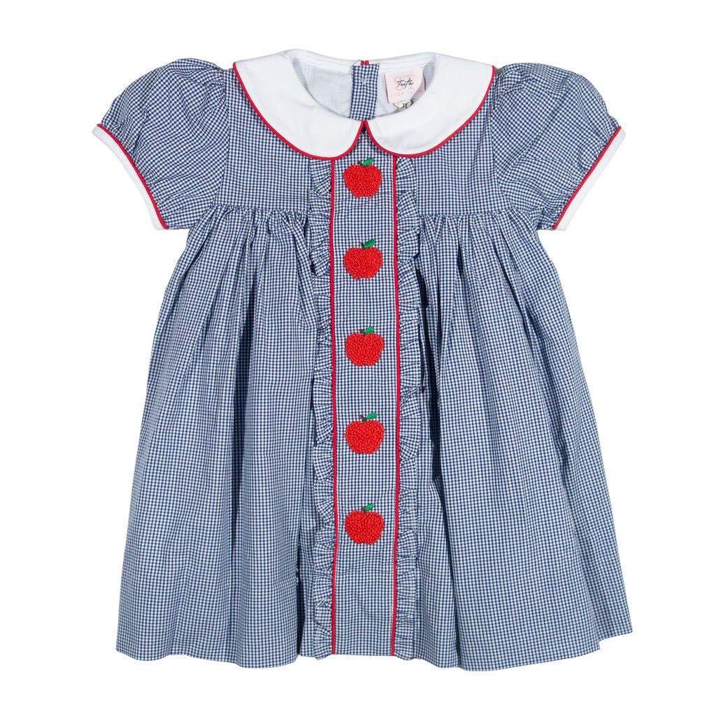 Blue checkered dress with red apple details on a white background