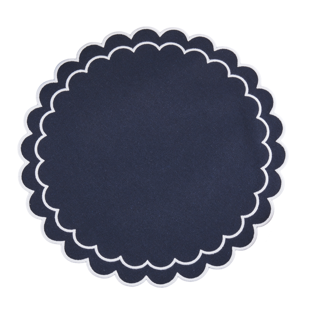 Navy blue scalloped placemat on a white background