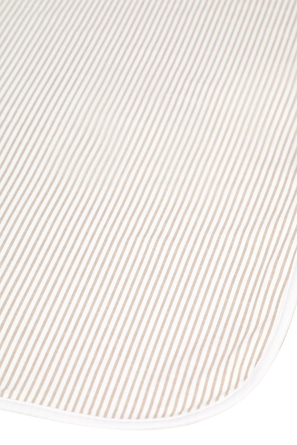 A close-up of a cream and white striped fabric, likely a baby blanket or changing mat, showing its fine vertical stripe pattern and white stitched border.