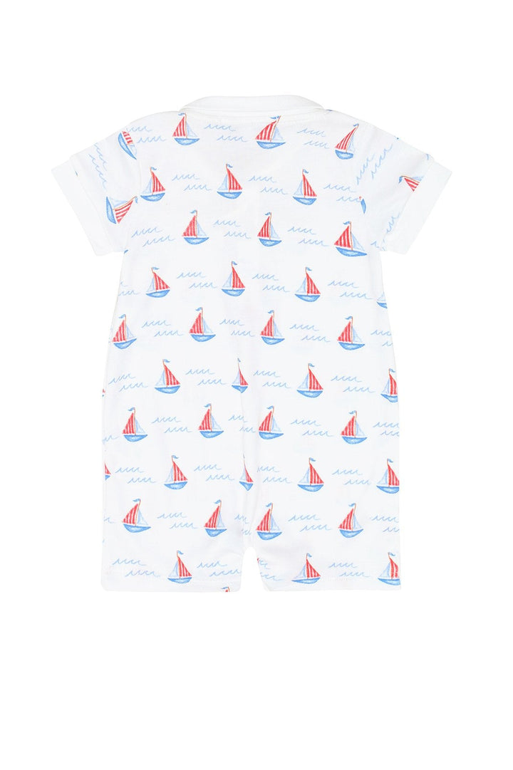 White romper with sailboat pattern on a white background