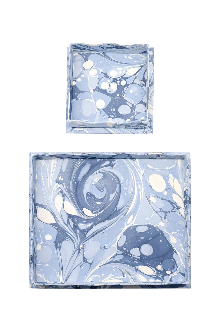 Two marbled blue and white square containers on a white background