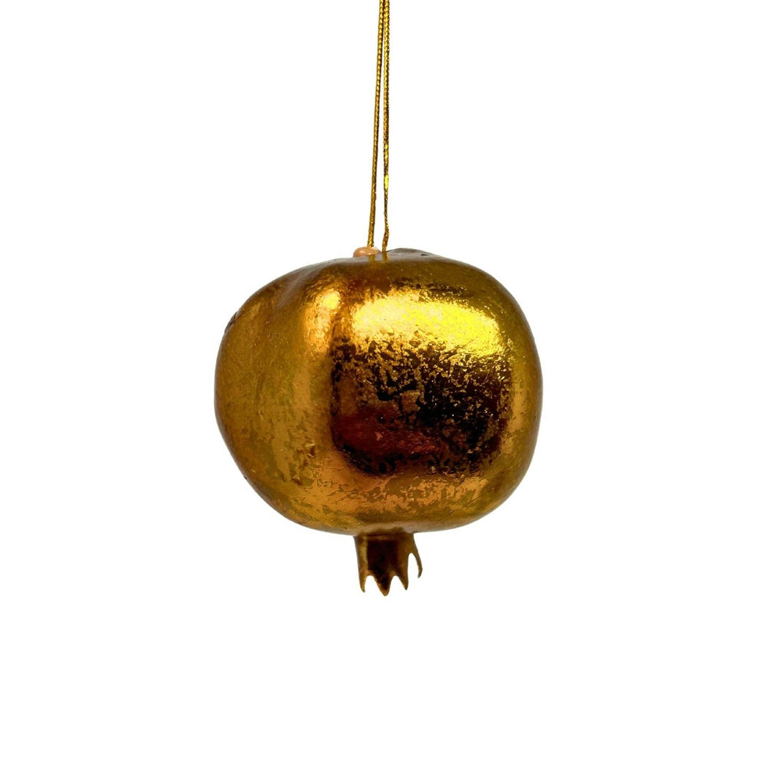 A metallic gold pomegranate-shaped hanging ornament with a textured, reflective finish and a thin gold hanging string, shown against a plain white background.