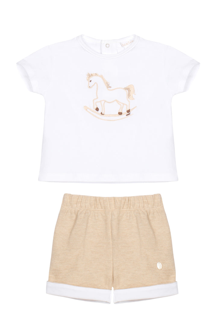 White t-shirt with a rocking horse design and beige shorts on a white background