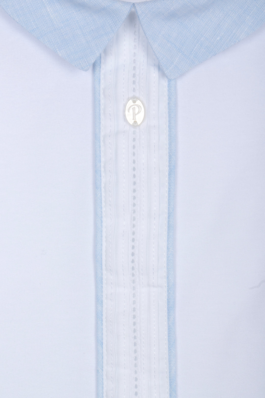 Close-up of a light blue dress shirt with a collar and button details.