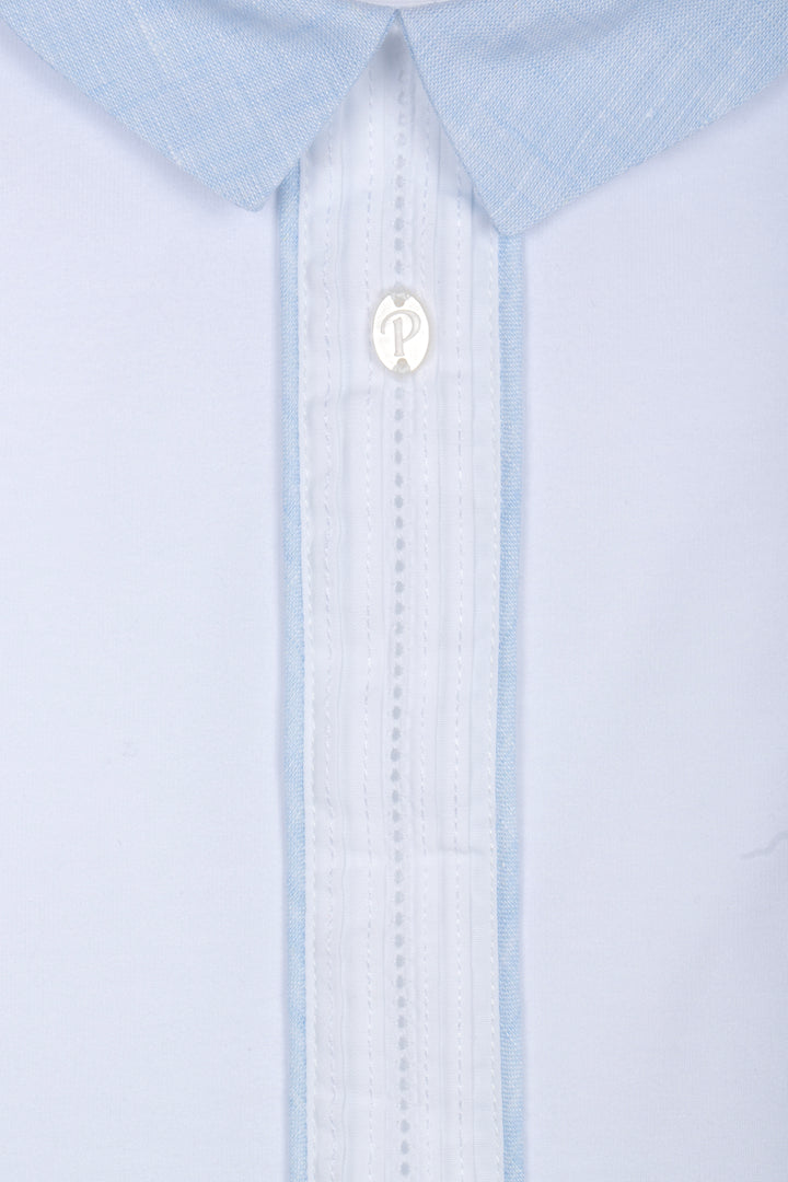 Close-up of a light blue dress shirt with a collar and button details.