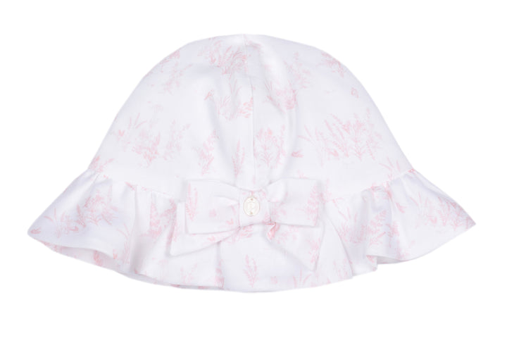 White bucket hat with pink floral pattern on a white background
