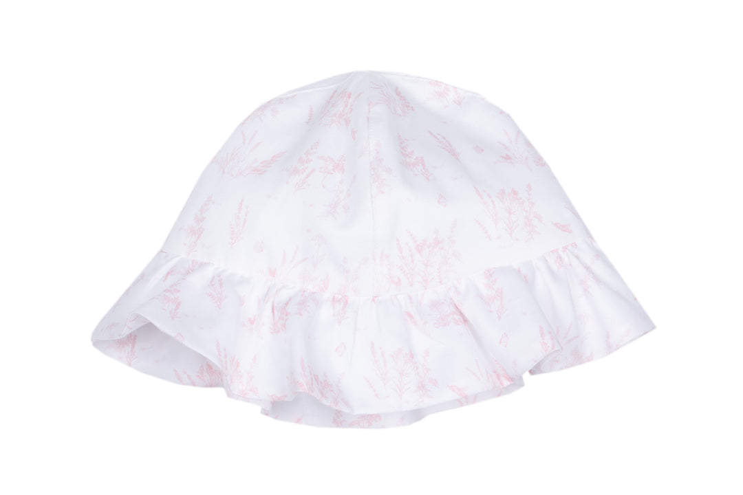 White baby bonnet with pink floral pattern on a white background