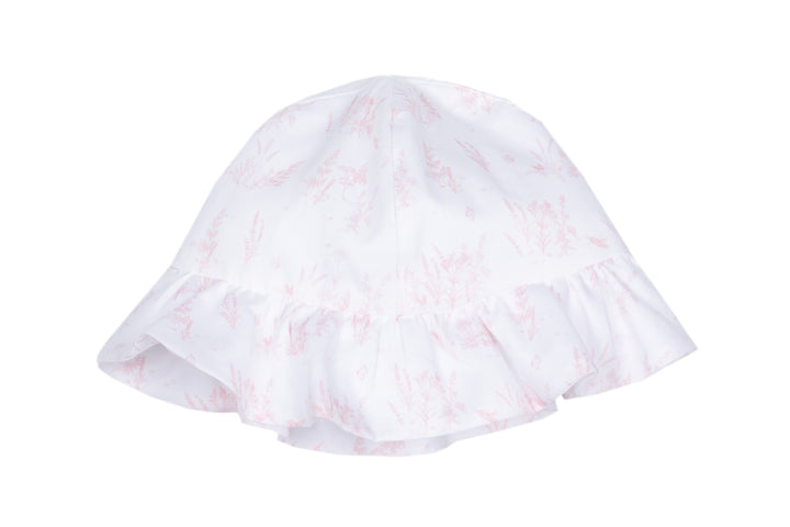 White baby bonnet with pink floral pattern on a white background