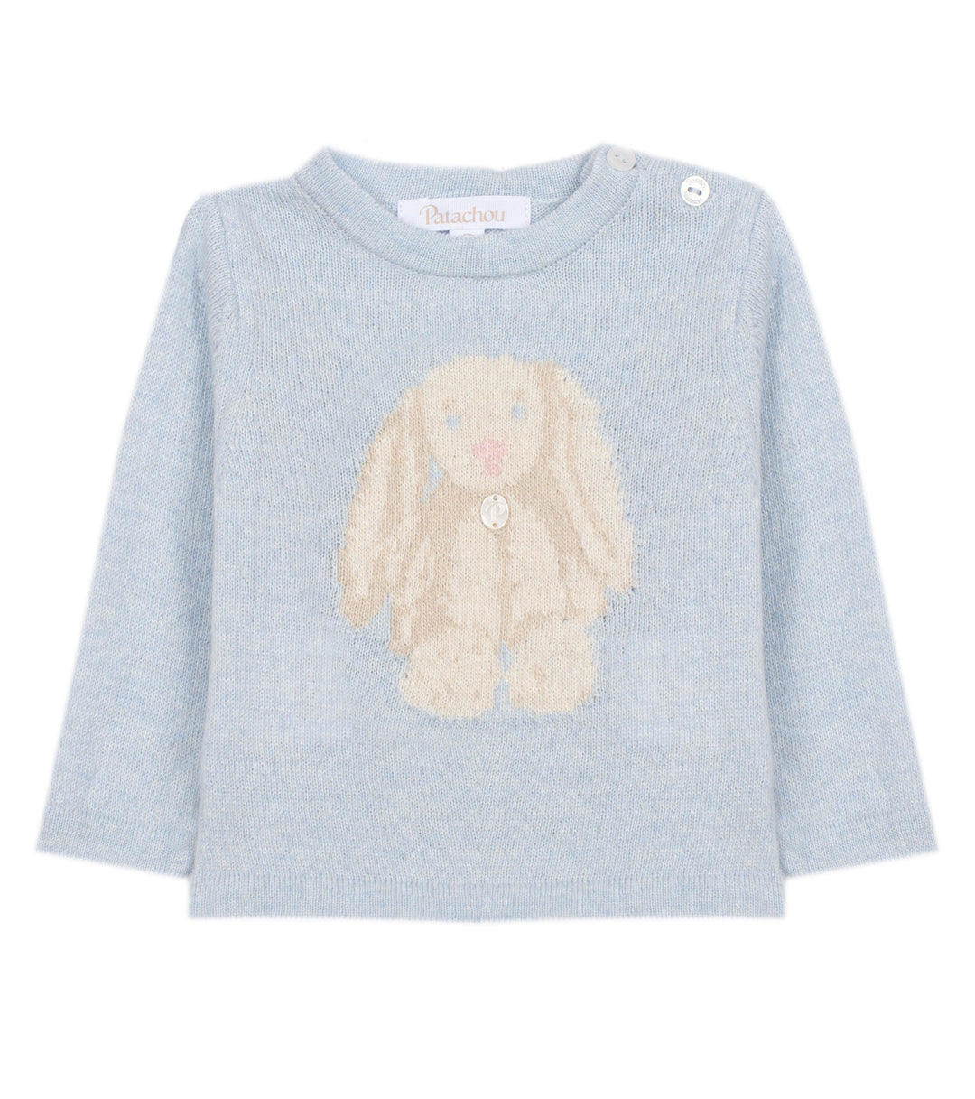 A light blue long-sleeve baby sweater featuring a knitted beige bunny motif on the front, with two button closures at the collar, shown against a plain white background.