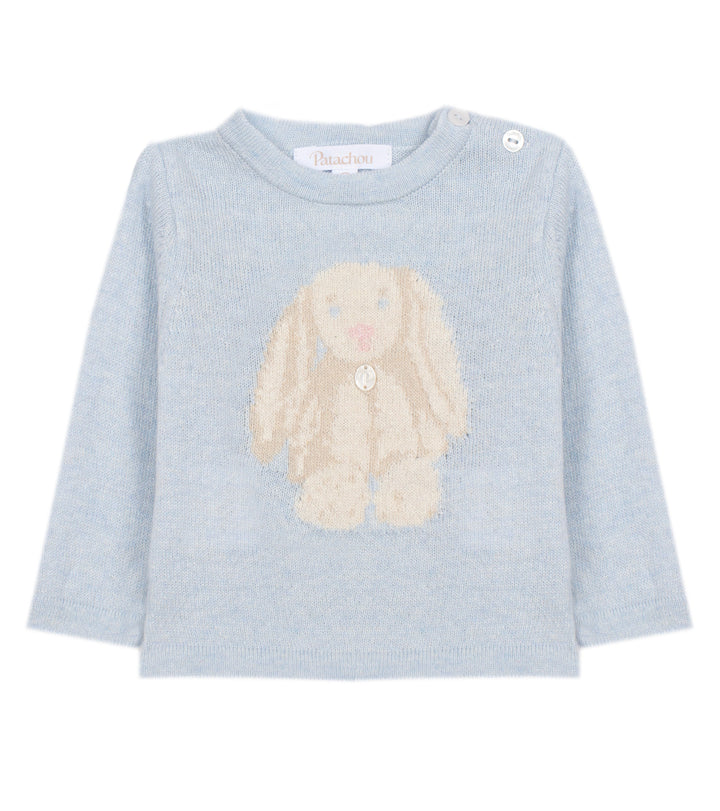 A light blue long-sleeve baby sweater featuring a knitted beige bunny motif on the front, with two button closures at the collar, shown against a plain white background.