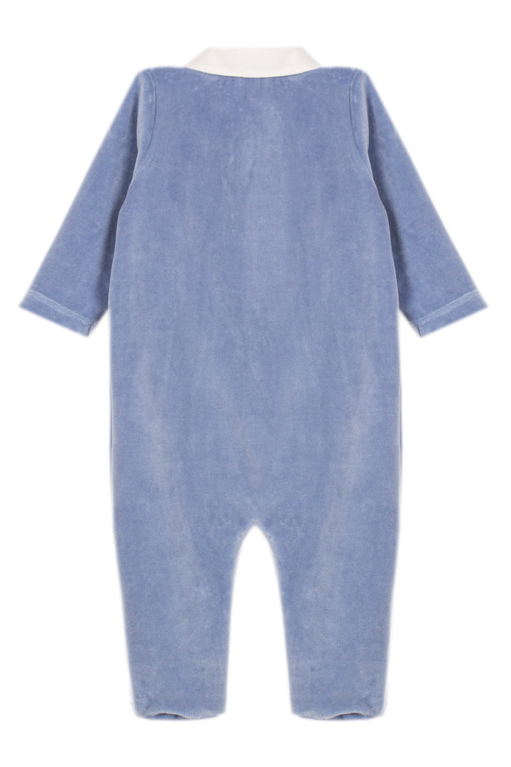 A baby's long-sleeve footless one-piece jumpsuit in a dusty blue corduroy fabric, shown from the back with a contrasting cream collar, on a solid white background.