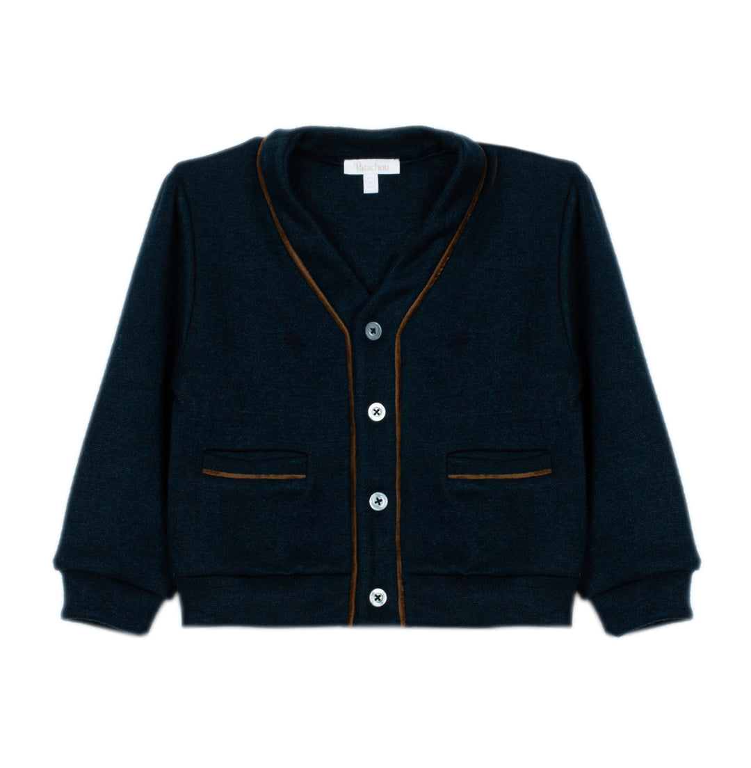 A dark navy blue knit cardigan sweater with thin brown contrast piping along the edges, featuring a button-up front and two front pockets, shown against a plain white background.