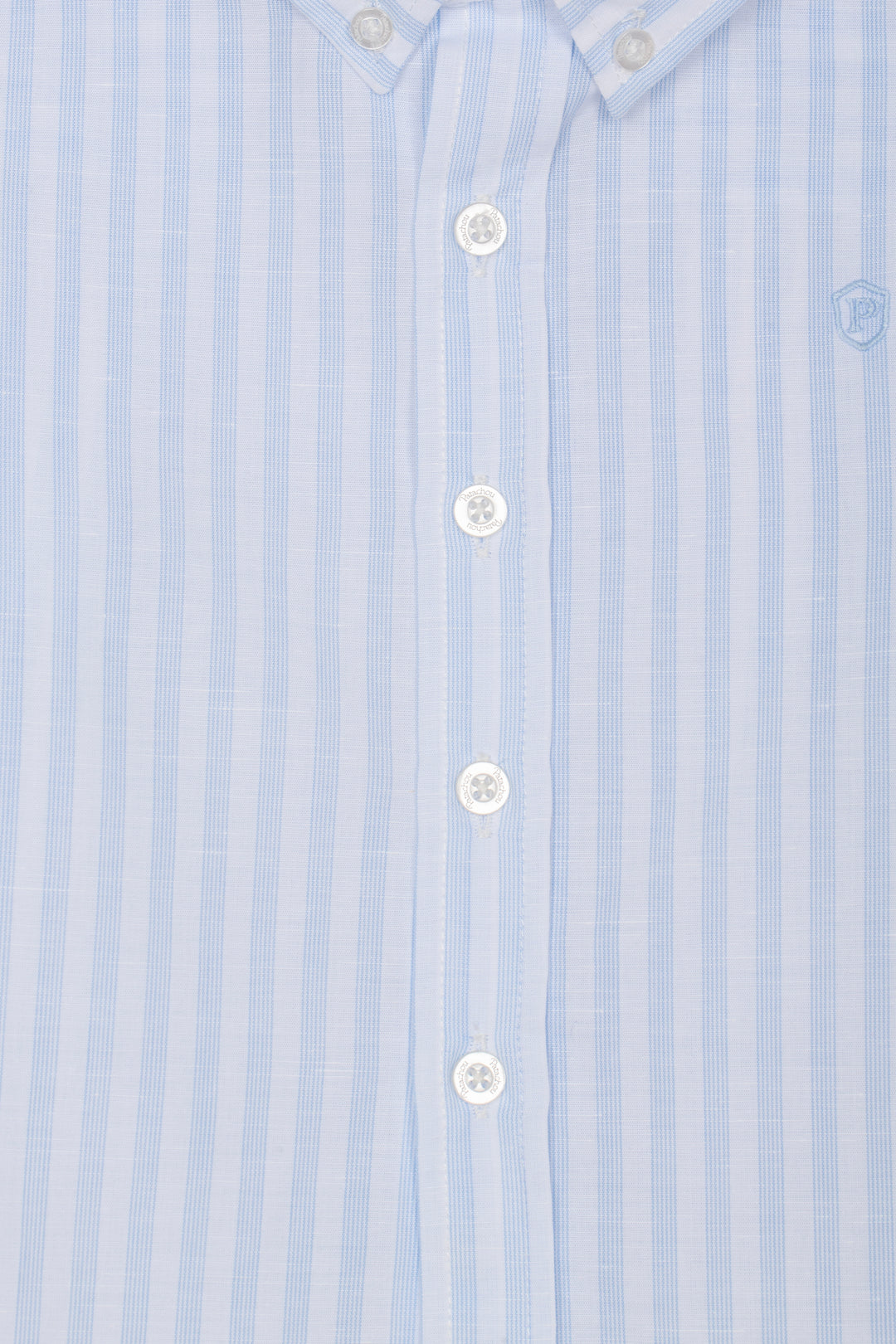 Close-up of a light blue striped shirt with white buttons